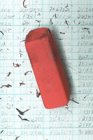 Eraser on ledger --- Image by © Jason Stang/Corbis
